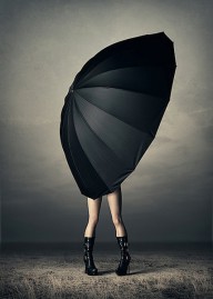 24846295 woman-with-huge-umbrella-johan-swanepoel